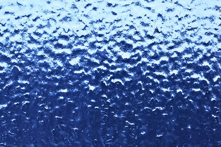 Window glass with ice, may be used as backgroundの写真素材