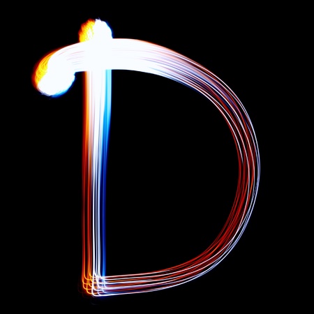 D - Created by light colorful letters over black backgroundの写真素材