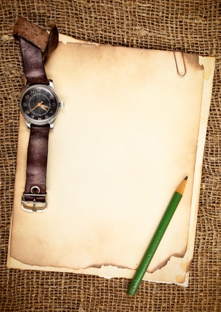 Still-life with old blank papers and wristwatchの写真素材
