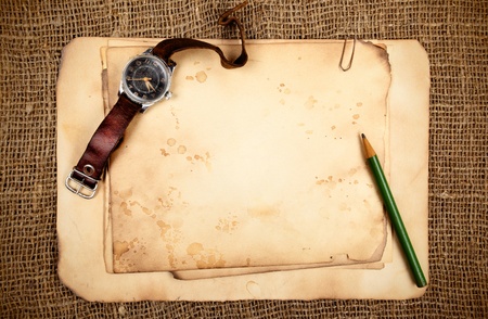 Still-life with old blank papers and wristwatchの写真素材