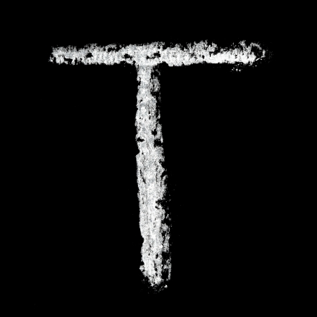 T - Chalk alphabet over black backgroundの写真素材