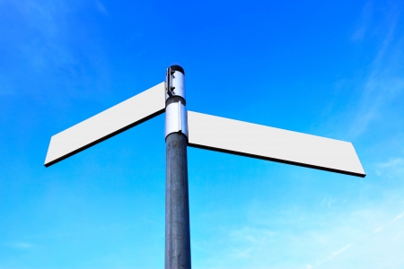 Blank white road signs over blue skyの写真素材