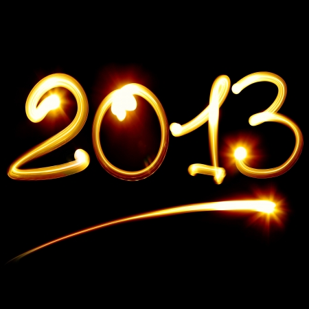 Happy new year 2013 message over black backgroundの写真素材