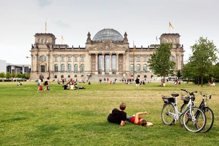 BERLIN - AUGUST 21: People are resting near parliament of Germany - Bundestag   August 21, 2012 in Berlin のeditorial素材