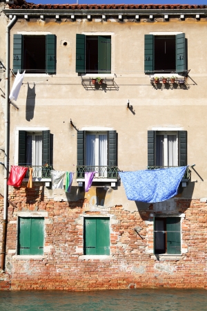 Old house at canal in Venice, Italyの写真素材