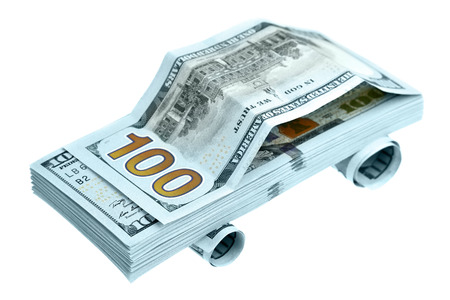 Car made of new hundred dollar bills isolated over the white backgroundの写真素材