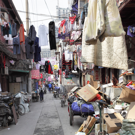 SHANGHAI, CHINA - APRIL 8, 2014  Old narrow street in Huangpu area with drying linenのeditorial素材