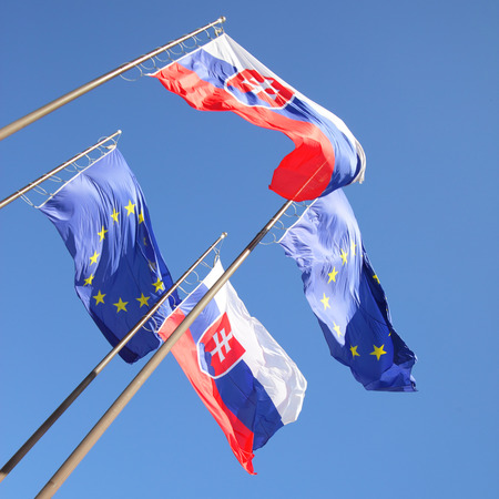 Flags of European Union and Slovakia in the windの写真素材
