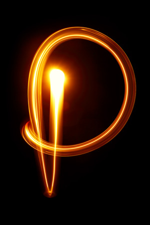 P - Created by light alphabet over black backgroundの写真素材