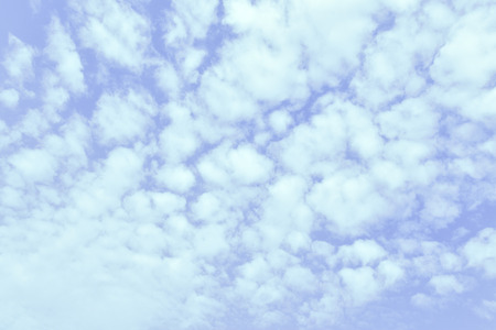 Light blue spring sky with clouds, may be used as background