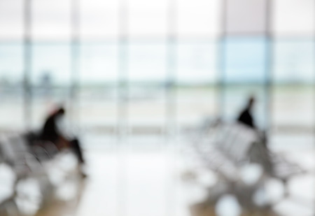 Passengers in the airport lounge - defocused blured backgroundの写真素材