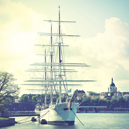 Historical ship at the Old Town in Stockholm, Sweden. Retro style filtred image