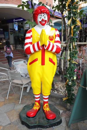 BANGKOK, THAILAND - DECEMBER 12, 2011 : Ronald McDonald in front of a McDonald's restaurant in the city centre in Bangkokのeditorial素材