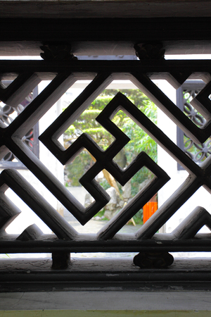 Swastika - decorative element of bars in ancient Yu Yuan Garden in Shanghai, China. Shallow DOF!の写真素材