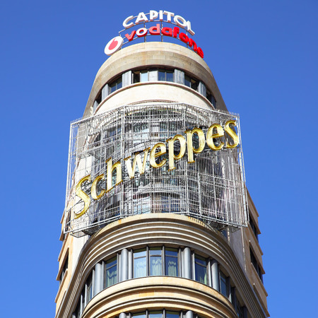 MADRID, SPAIN - September 06, 2016: Top of the Capitol building with neon sign in Madridのeditorial素材