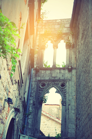 Ancient ruins in Old town of Kotor, Montenegro. Retro style filtered imageの写真素材