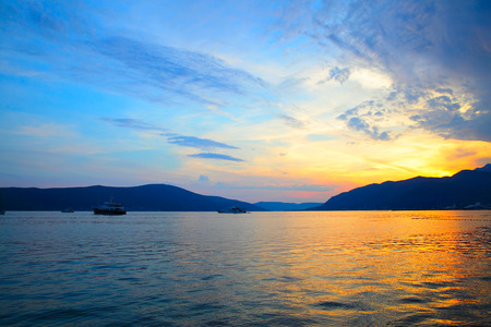 Colorful water and sky at sundown in The Bay of Kotor, Montenegro