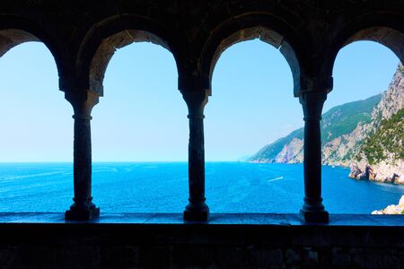 Sea and columns of Church of St. Peter in Porto Venere (Portovenere) town on Ligurian coast, La...