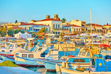 Aegina, Greece  - September 12, 2019: Fishing boats and yachts in the port of Aeginaのeditorial素材