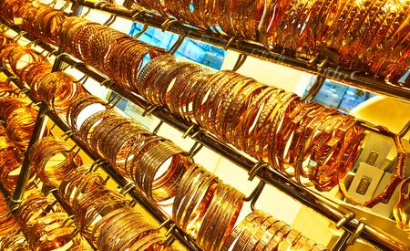 Golden bracelets in a jewelery shop at the Golden Souk market in Dubai, UAE