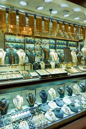 Dubai, UAE - January 31, 2020: Shop window of a jewelery store with gold ware at the Golden Souk market in Dubai, United Arab Emiratesのeditorial素材