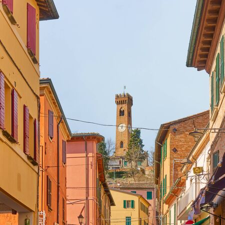 Old street and bell tower in Santarcangelo di Romagna town, Emilia-Romagna,  Italyの写真素材