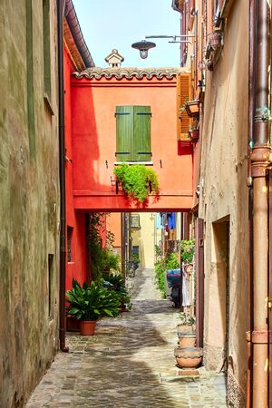 Ancient narrow alley in San Giovanni in Marignano, Italy - Italian cityscapeの写真素材
