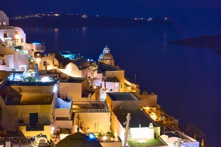 Thira town in Santorini Island at night, Greeceの写真素材