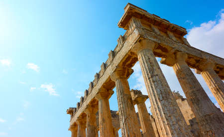 Columns of Temple of Aphaea in Aegina Island, Saronic Islands, Greece. View of greel landmark with space for your own textの素材 [FY310157907495]