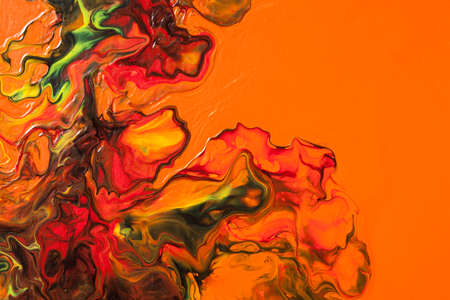 Fantastical floral pattern of liquid paint.  Orange fluid art abstract backgroundの写真素材