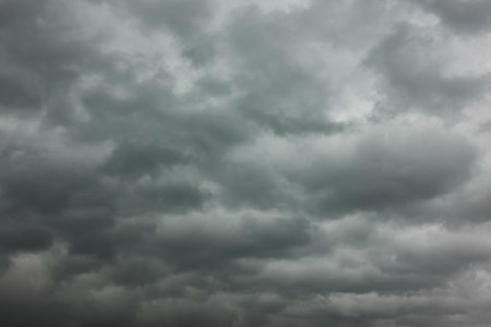 Gloomy sky. Heavy stormy clouds, may be used as backgroundの写真素材