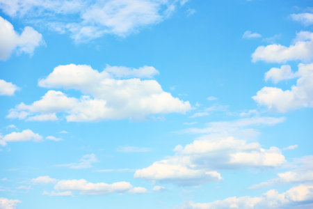 Light blue sky with white clouds in fine weather , may be used as backgroundの写真素材