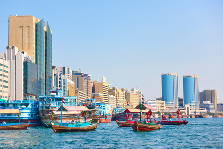 Dubai, UAE - January 31, 2020:  The Dubai Creek with abra and dhow boats in Deira district in Dubai, United Arab Emiratesのeditorial素材