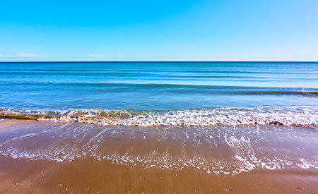 Sea beach with soft waves - Panoramic backgroundの写真素材