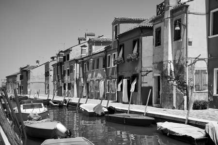 Canal in Burano in Venice, Italy. Black and white photography, italian cityscapeの写真素材