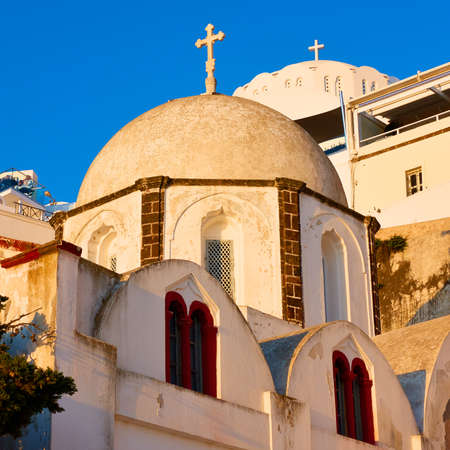Domes of greek churches at sunset, Santorini, Greeceの写真素材