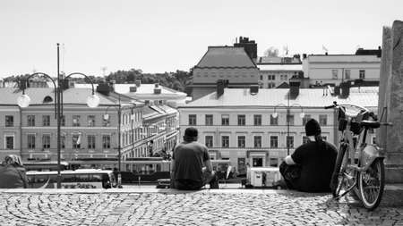 Helsinki, Finland - July 26, 2017: Senate Square in Helsinki and resting people on the stairs. Black and white photographyのeditorial素材