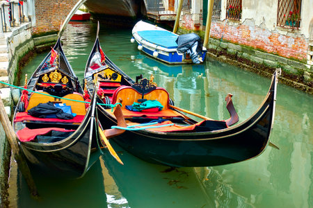 Venice, Italy  - June 18, 2018: Two gondolas close up  on  canal in Veniceのeditorial素材