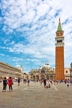 Venice, Italy - June 18, 2018: People in The Saint Mark's square near The Campanile and The Saint Mark's  Basilica in Venice. Landmarks, venetian cityscapeのeditorial素材