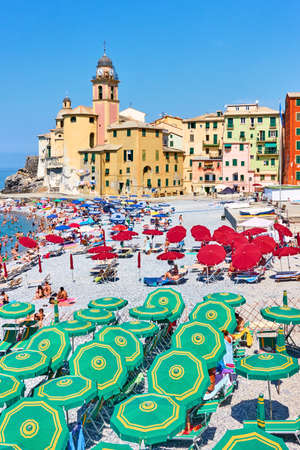 Camogli, Genoa, Italy - July 3, 2019:  Beach with parasols and sunbathing people in Camogli, Genovaのeditorial素材