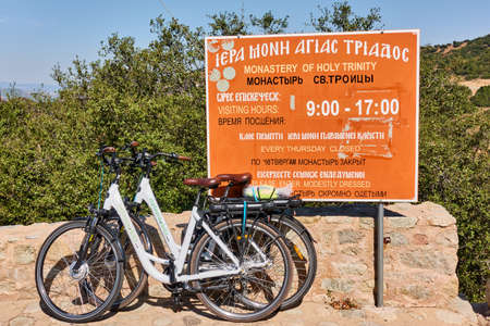 Meteora, Kalambaka, Greece - September 17, 2019:  Rented bicycles by the sign of Nonastery of Holy Trinity point in Meteoraのeditorial素材