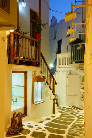 Mykonos, Greece - April 21, 2018: Alley in Mykonos (Chora) town at nightのeditorial素材