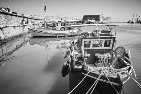 Fishing boats in Venetian Harbor of Heraklion, Crete Island, Greece. Black and white photographyのeditorial素材