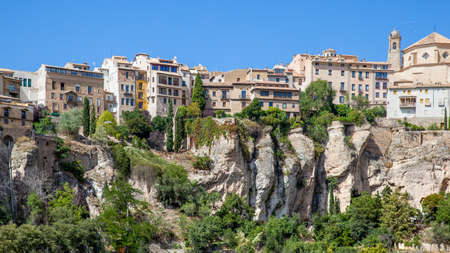 Houses on the very brink of cliff. Panoramic view of the old town of Cuenca, Castilla-La Mancha, Spain. Landscape - cityscapeの写真素材