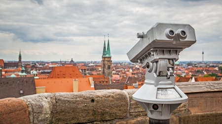 Nuremberg, Germany - May 17, 2016: Panoramic view of the old town from viewing point in Nuremberg with touristic telescopeのeditorial素材