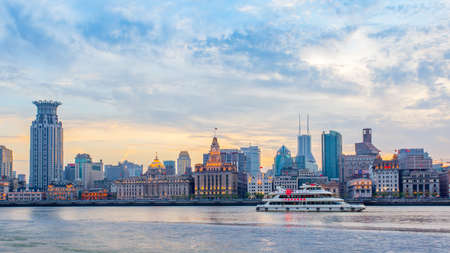 Shanghai, China - April 10, 2014: Shanghai city with The Bund waterfront and river at twilight. Panoramic viewのeditorial素材