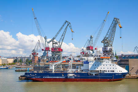 Helsinki, Finland - July 26, 2017:  Cargo port in Helsinki with cranes and shipのeditorial素材