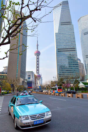 Shanghai, China - April 8, 2014: Taxi car in the street in Shanghai city. Wide angle shotのeditorial素材