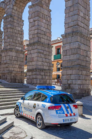 Segovia, Spain - September 21, 2015: Police car by Roman aqueduct in Segoviaのeditorial素材