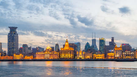 Shanghai, China - April 10, 2014: Panoramic view of Shanghai city with The Bund waterfront and river at duskのeditorial素材
